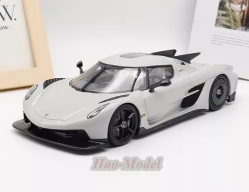 White 1/18 resin diecast sports car model with black wheels and rear wing