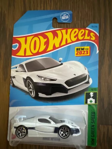 White diecast speed car with black front, in Hot Wheels blister pack