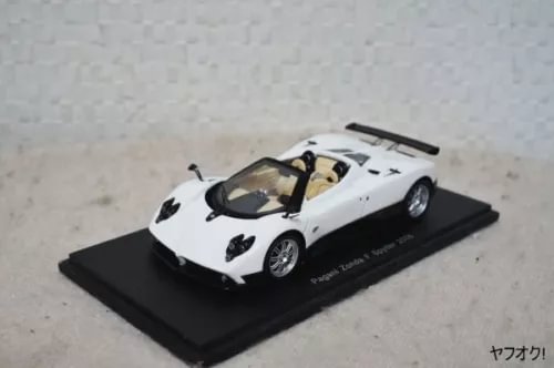 White sports car diecast model on black display base