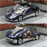 Metal diecast model car, dark blue roadster with silver wheels and open-top detail