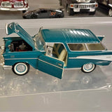 Teal diecast vintage pickup truck model with open driver door