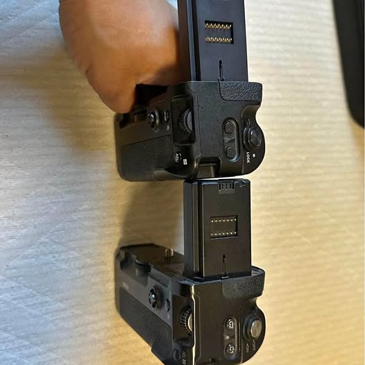 Black camera grip mount with adjustable clamp and ports