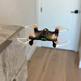 Mini drone with four propellers and central camera, dark body with LED light