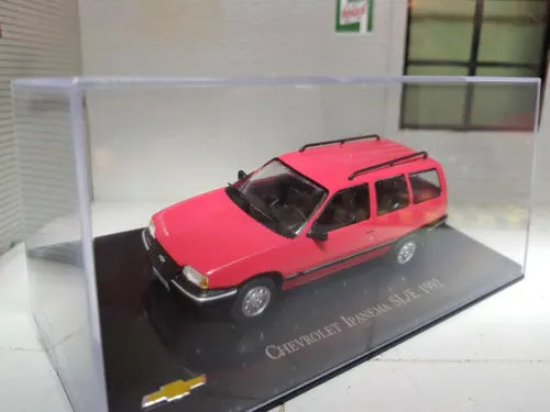 Red diecast scale model car with black hood stripe on display base