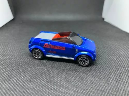 Blue diecast model sports car with black wheels and orange interior detail