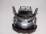 Dark gray diecast toy sports car with front splitter and butterfly doors