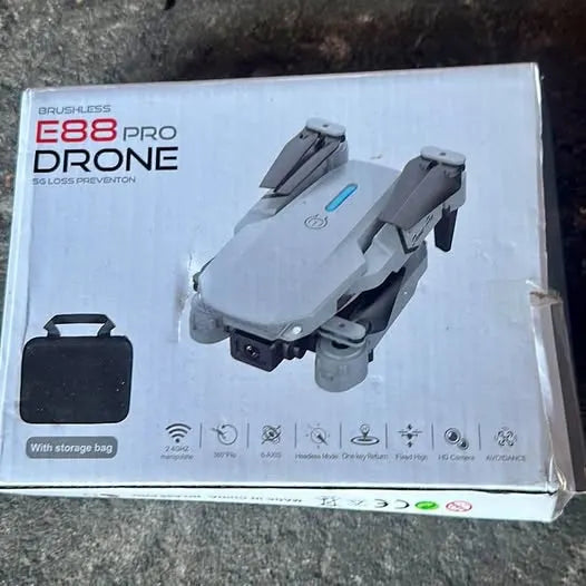Gray E88 Pro drone with foldable arms and front camera on retail box
