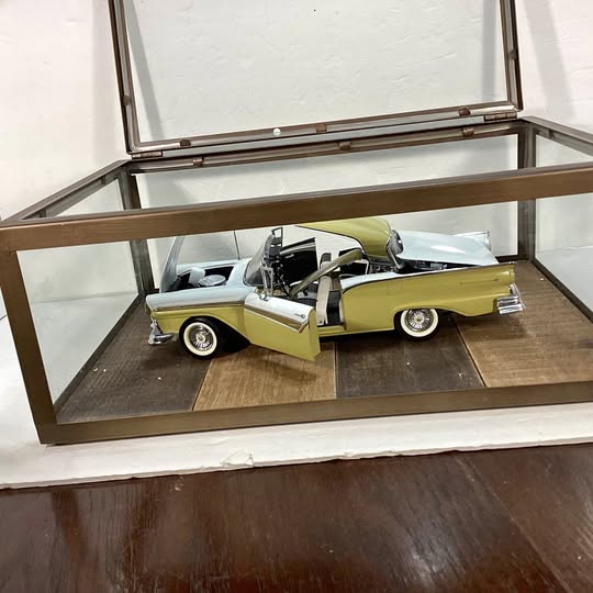 Yellow 1957 Ford Fairlane Skyliner convertible diecast car with open roof, detailed interior