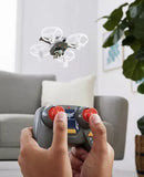 Handheld RC drone remote controller with red joystick grips and gray body