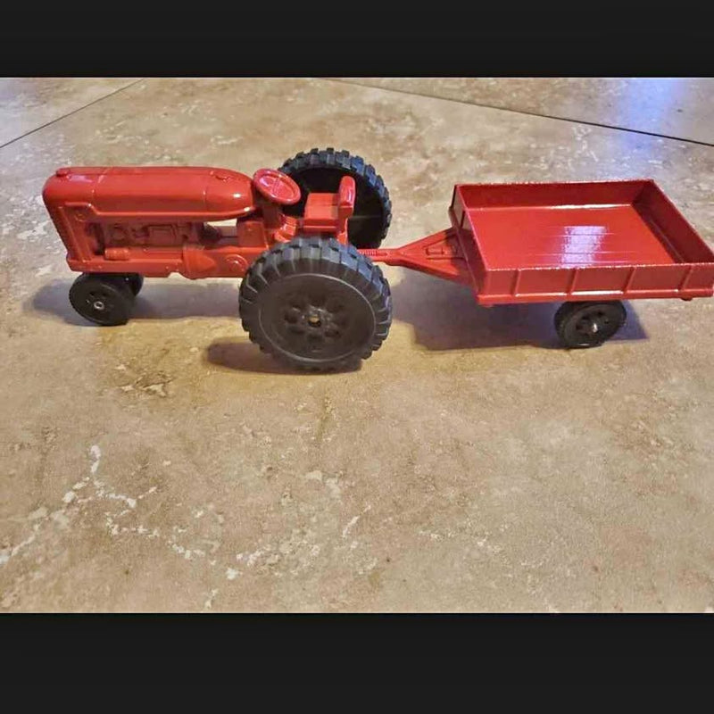 Red vintage toy tractor with T.T trailer, diecast model