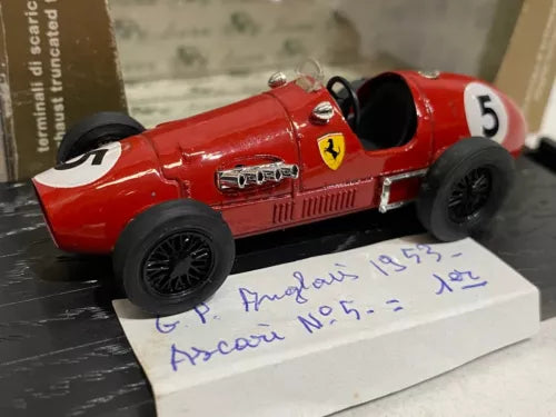 Red Ferrari race car diecast model with front wing and No. 5 on side