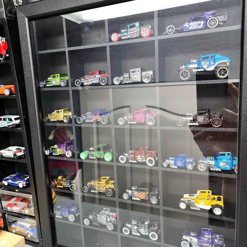 Diecast vehicle display case with assorted miniature cars and trucks on shelves