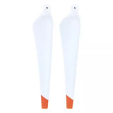 Pair of drone propellers, white blades with orange tips, circular mounting holes