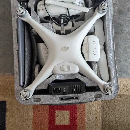 DJI Phantom 4 Advanced drone in white hard case with propellers