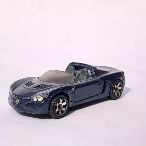 Dark blue diecast sports car with open top and silver hood details, 1:55 scale