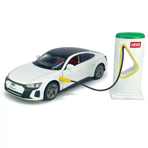 White diecast toy model car with black wheels, connected to charging station and cable