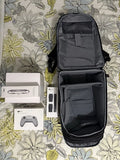 Black zippered carry case with interior compartments and accessory items