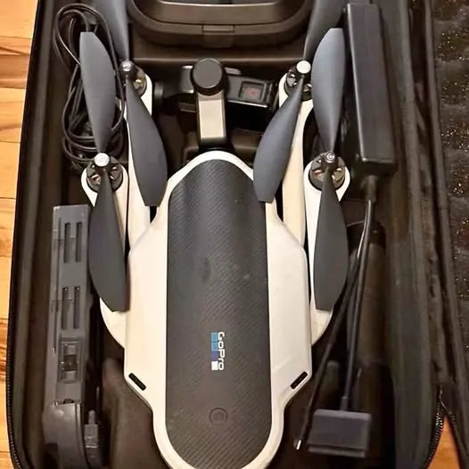 Compact folding drone with central camera module and folded propellers