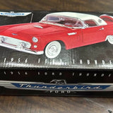 Red vintage Ford Thunderbird diecast car model with chrome grille and whitewall tires
