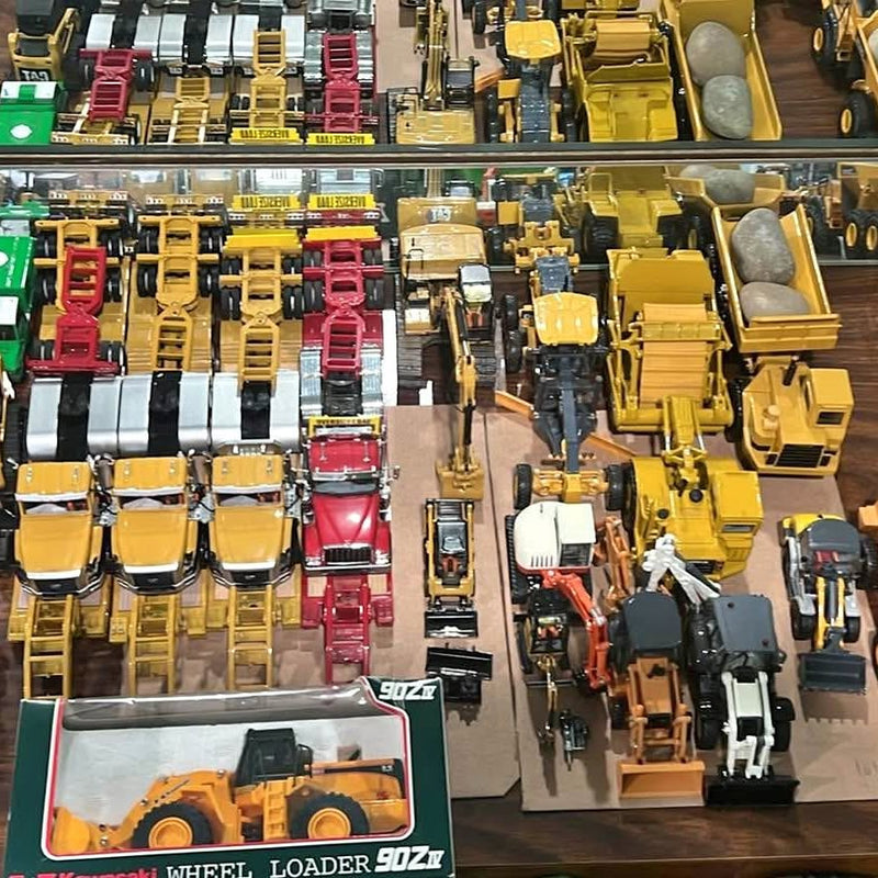 1/50 scale diecast construction vehicle lot with yellow wheel loaders and trucks