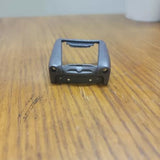 Weathered diecast car front frame with rectangular grille opening, small scale