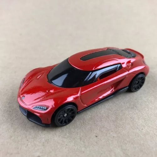 Red 1:64 diecast sports car with black hood and side details