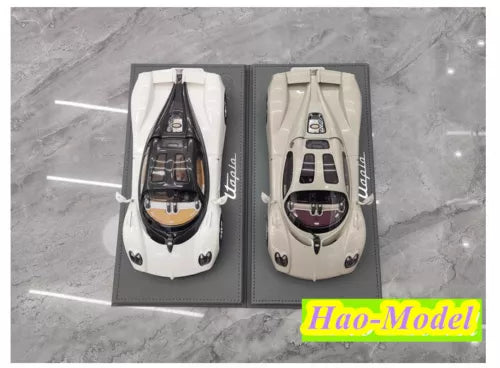 1/18 supercar model car set with white and beige bodies, visible black cockpit details