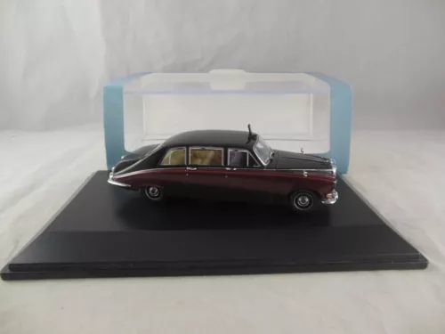 Claret and black diecast model car with display case, 1:43 scale
