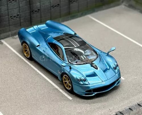 Ice blue 1:64 racing sports diecast car with gold wheels and aerodynamic front