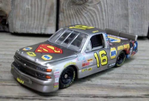 Silver diecast race car toy with blue and yellow #16 graphic, 1/64 scale