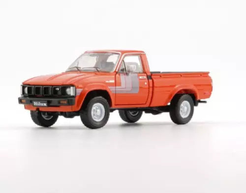 Orange 1980 Toyota Hilux LHD diecast pickup, 1:64 scale.