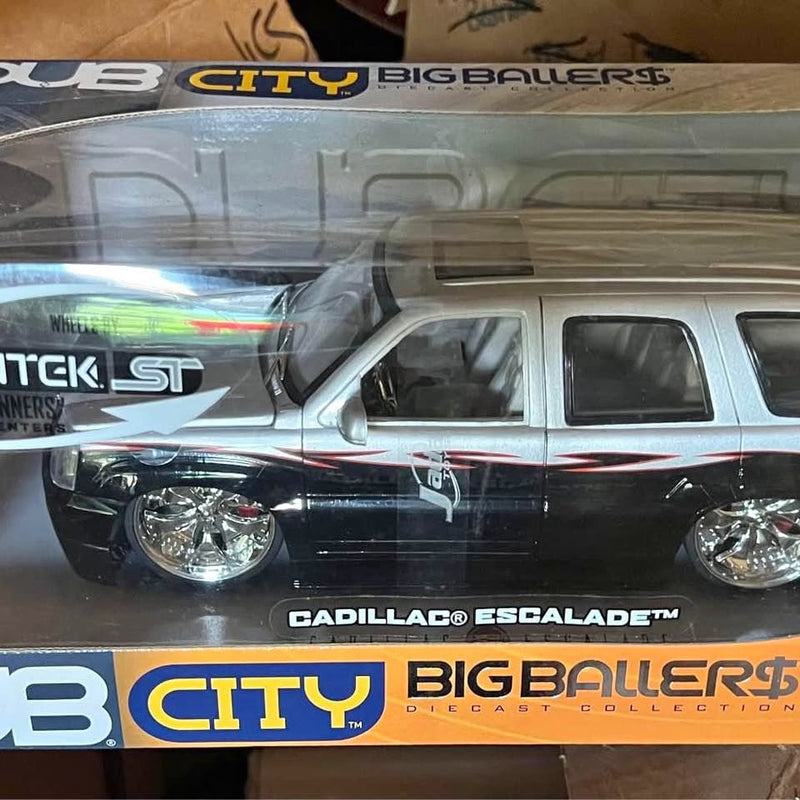 Diecast Cadillac Escalade 2002 SUV model, front view, silver and black, chrome details