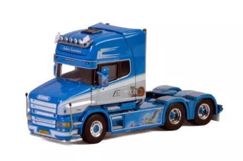 Blue and gray diecast model semi truck with chrome grille and blue trailer chassis