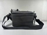 Black folding drone storage bag with shoulder strap and front pouch
