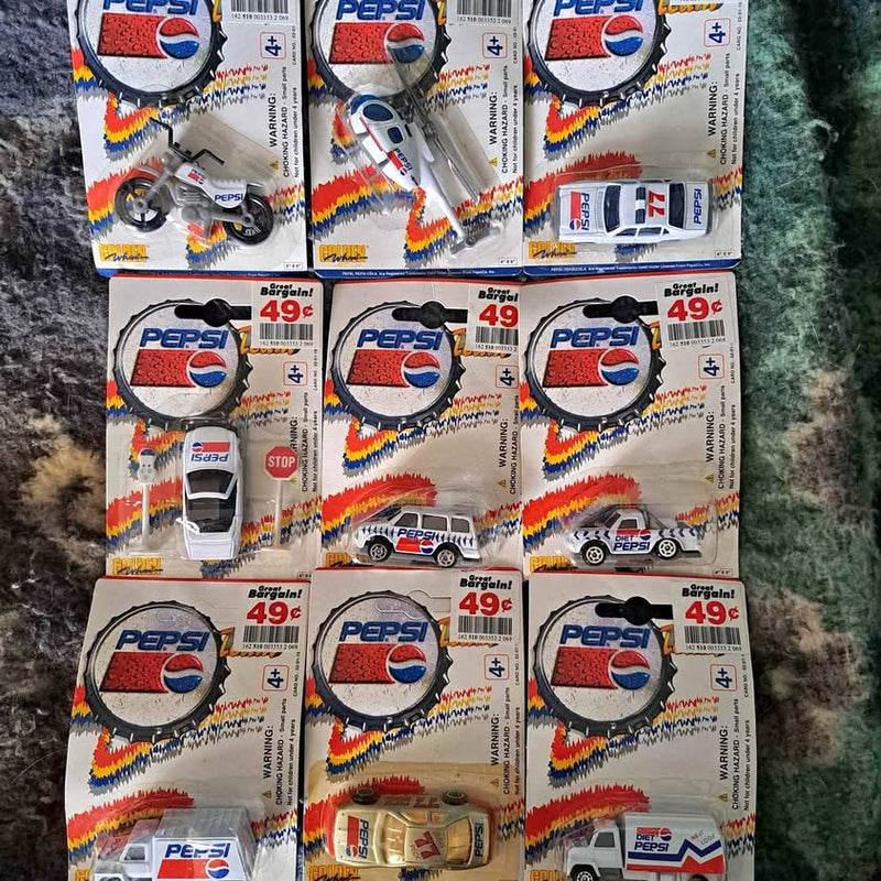 Set of Pepsi diecast car toys in boxed packaging