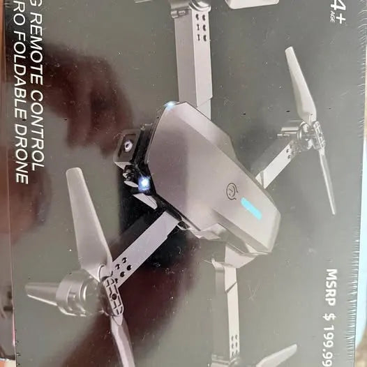 Clearwater FL foldable quadcopter drone with four propellers extended and front light