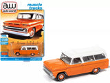 Orange and white diecast toy 1965 Chevrolet Suburban SUV with white roof