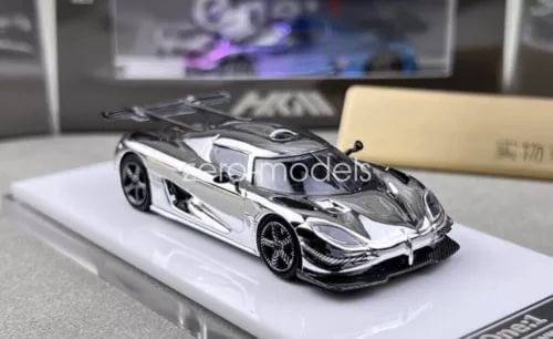 Silver racing sports diecast model car with detailed front grille and headlights