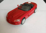 Red diecast convertible car model with open-top body and white wheels