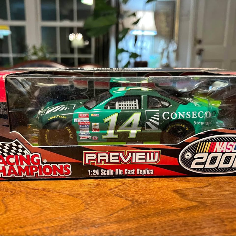 Green #14 racing diecast replica car, 1:24 scale, Conseco logo
