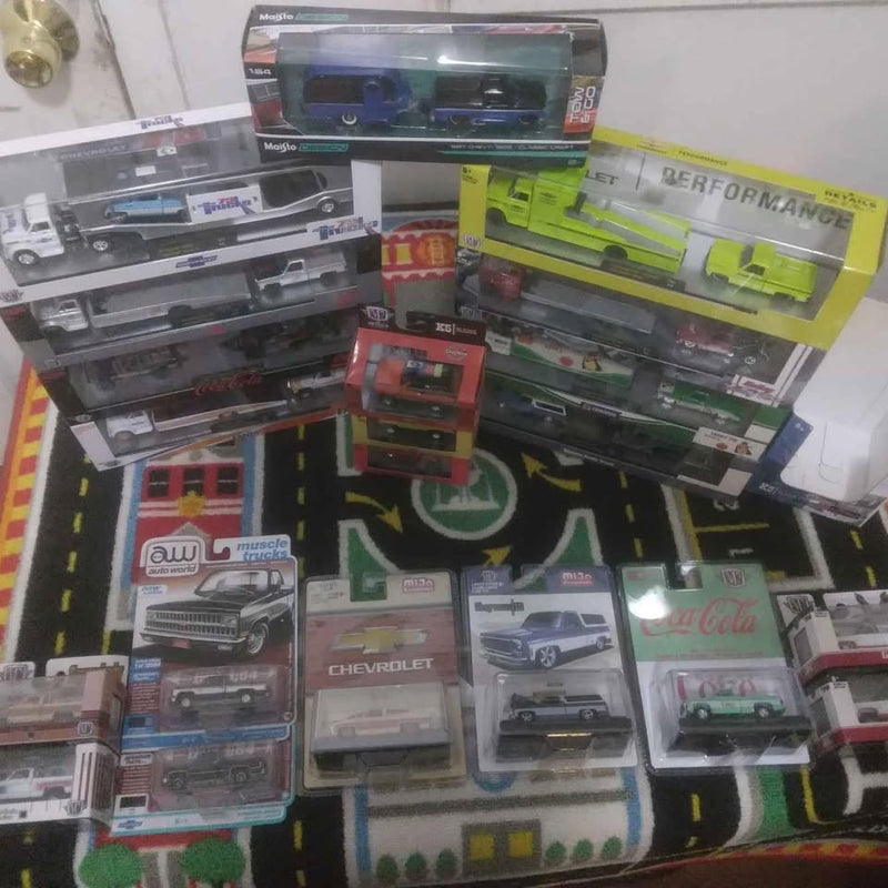 Diecast model truck assortment in retail boxes, with multiple C10-style trucks
