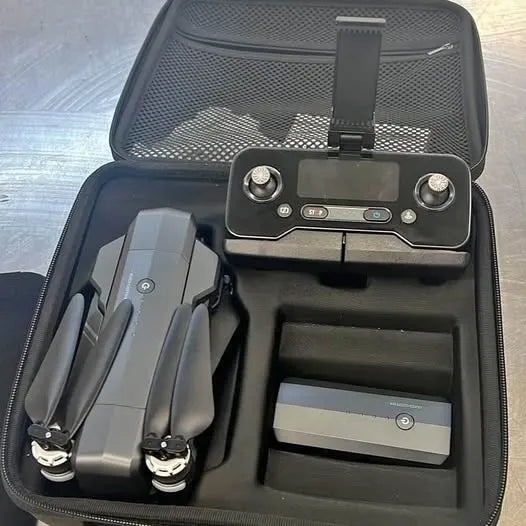 Drone with controller, batteries and propellers in zippered hard case