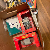 Boxed 1:24 sprint car diecast models, red and teal packaging