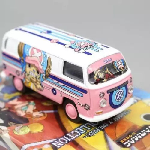 Pink and white diecast VW T1 van bus model toy with cartoon decals, front 3/4 view