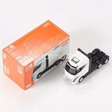 White and black 1:64 diecast model truck with orange box packaging