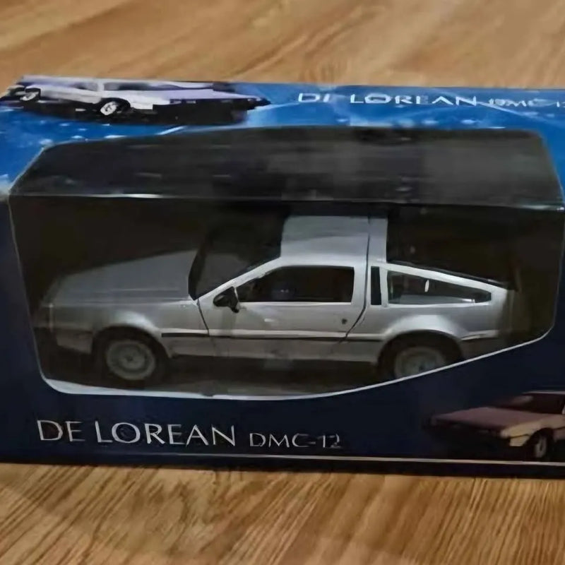 White DeLorean DMC-12 diecast model car in clear display box, 1:24 scale