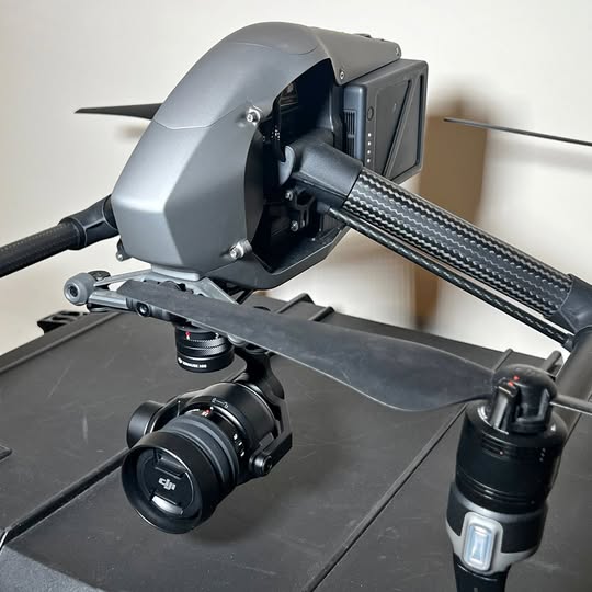 DJI Inspire 2 drone with carbon-fiber gimbal and camera lens, remote controller