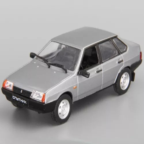 Gray diecast model car with open windows, front three-quarter view, white wheels.