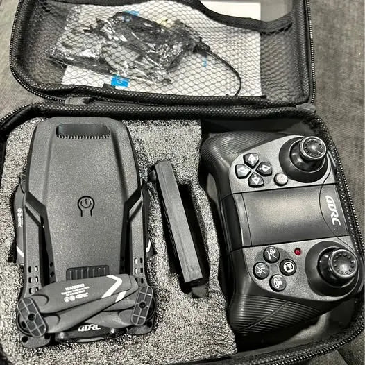 Drone kit in hard case with remote controller and compact drone body