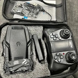 Drone kit in hard case with remote controller and compact drone body